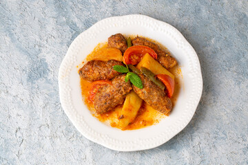 Traditional Homemade Turkish Food Kofte - Kofta with Tomato Sauce and Potatoes. (Turkish name; Izmir kofte)