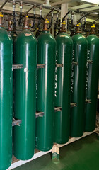 Many oxygen cylinders and argon cylinders with compressed gas secured in the Gas factory warehouse....