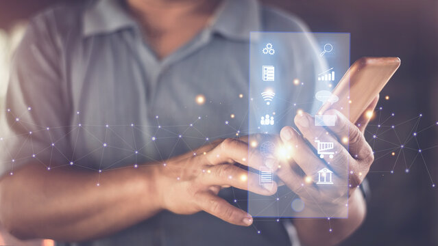 Man using applications on smartphone for internet browsing, data search, stock trading analysis, e-commerce , chat and email communication, financial information, mobile banking, Online transaction.