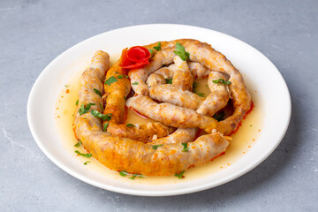 Traditional delicious Turkish cuisine, Middle Eastern dishes, offal dishes, stuffed sheep intestines (Turkish name; Mumbar dolmasi)