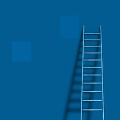 Ladder leans to blue wall