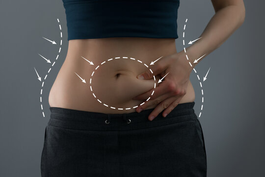 Abdominal fat problems, massaging marks. Healthy lifestyle and sports activities concept