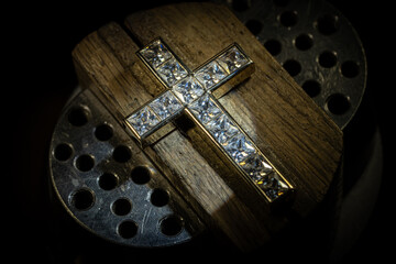 Craft jewelery making with professional tools. cross repairing. Putting the diamond on the cross. Macro shot. A handmade jeweler process, manufacture of jewelery.