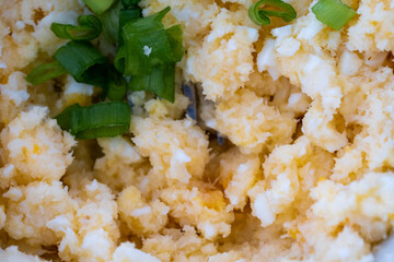 homemade breakfast, yellow cheese with holes, small sliced tomatoes, cottage cheese, egg paste, eggs, chives, tea, orange, carrot and grapefruit juice in wine glasses, black tableware.