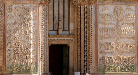 Detail of the facade famous cathedral Santa Maria Assunta made of mosaic scenes from the bible...