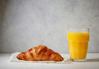 freshly baked croissant and juice