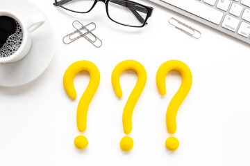 Question mark symbol on office desk. Solving problem or search solution concept