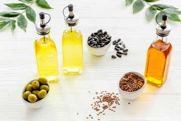 Cooking oil in bottles. Sunflower olive and sesame oil with ingredients