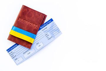 Ukrainian immigration concept - yellow and blue ribbon on passport