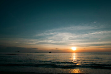 Naklejka na ściany i meble Amazing sunset on a deserted tropical beach.