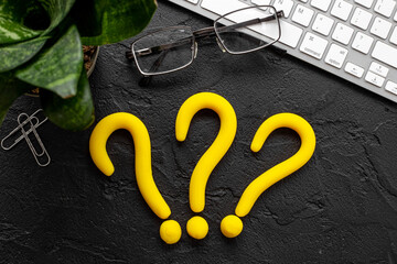 Question mark symbol on office desk. Solving problem or search solution concept