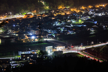 Fototapeta na wymiar Overhead view of intersection in quiet village at night