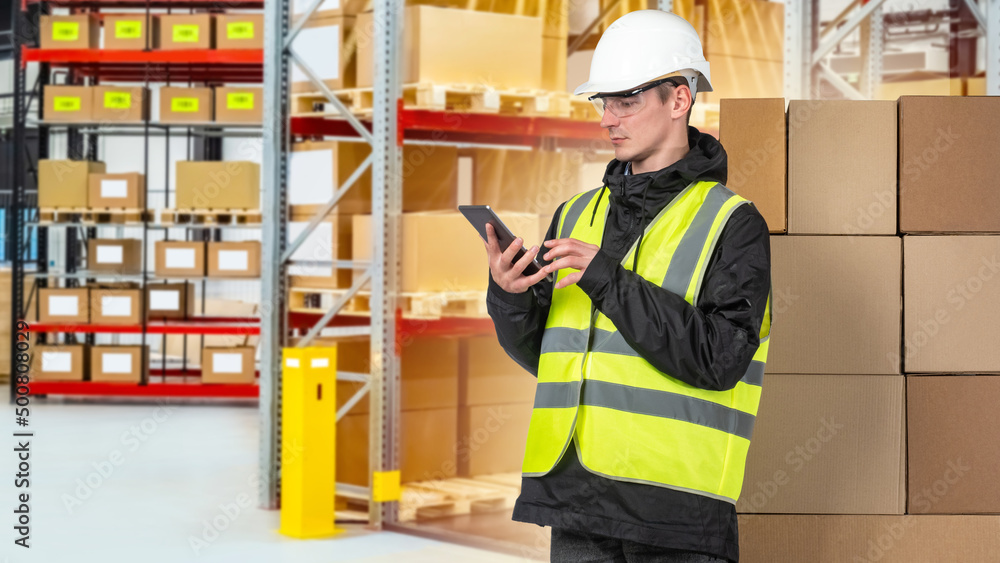 Aufkleber man with a tablet in a warehouse. factory technician working using digital tablet at factory warehou