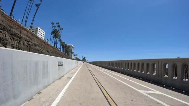 Rear view ride down the California Incline bike ramp near Santa Monica beach in Los Angeles County, California.