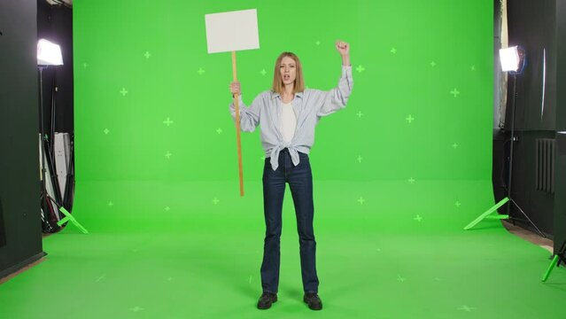 Woman hold placard in hand. Tracking point copy space. Strike out protest action. Peaceful picket line banner over green screen background . Stop war, Political rally