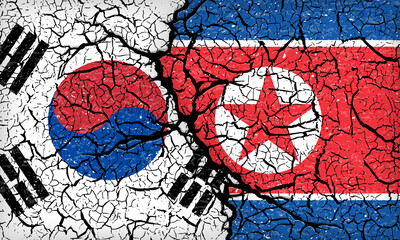 韓国と北朝鮮国旗がひび割れている背景