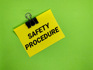 Paper clip with yellow paper with the words Safety Procedure.