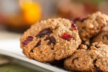 Oatmeal cranberry chocolate cookies with warm fall colors.
