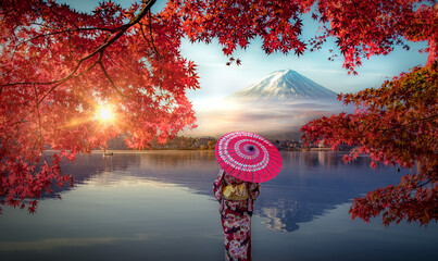 Colorful Autumn Season and Mountain Fuji with Asian woman wearing japanese traditional kimono at...
