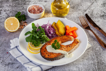 salmon steak in white plate