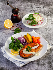 salmon steak in white plate