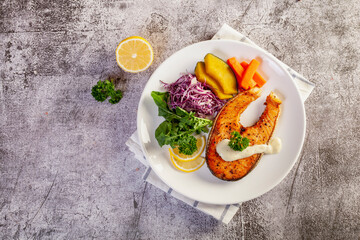 salmon steak in white plate