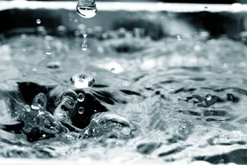 Foto op Plexiglas Macro shot of liquid drop © taffpixture