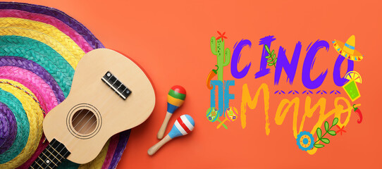 Fototapeta Mexican sombrero hat, guitar, maracas and text CINCO DE MAYO (Fifth of May) on orange background obraz
