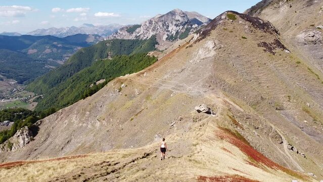 Female Walks Downhill a Mountain Trail in Prokletije National Park, Montenegro - Dolly Follow