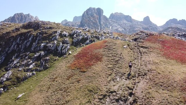 Woman Hikes Uphill a Mountain Trail in Prokletije National Park, Montenegro - Dolly
