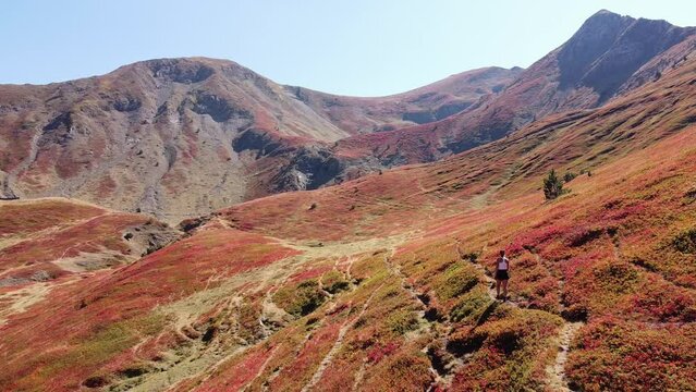 Woman Walks Red Valley in Prokletije National Park, Montenegro - Dolly