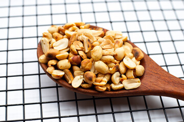 Roasted peanuts on white background.