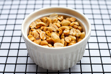 Roasted peanuts on white background.