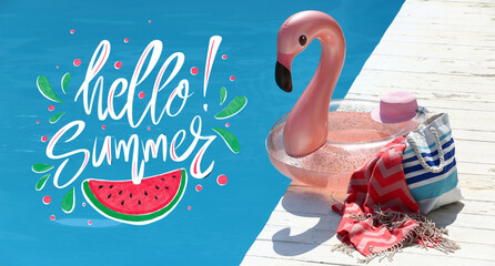 Inflatable ring and beach accessories on edge of swimming pool. Hello, summer © Pixel-Shot