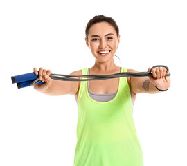 Sporty young woman with skipping rope on white background