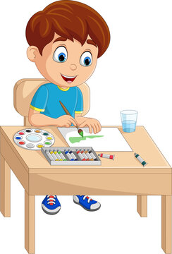 Cartoon little boy painting on the desk