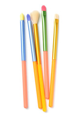 Colorful makeup brushes on white background