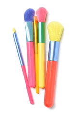 Colorful makeup brushes on white background