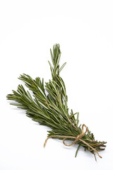 Bunch of rosemary sprigs on white background. Rosmarinus officinalis bundle, close up.