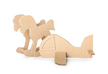 Cardboard rocking horse and plane on white background