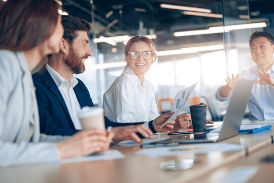 Group Of Modern,Lawyers, Businesspeople And Investors Gather At The Table In Corporate Meeting Room.