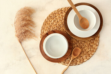 Elegant table setting with pampas grass on light background
