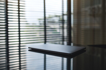 A single laptop computer on the table
