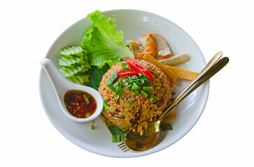 Fried rice and vegetables with fish sauce in spoon in white dish