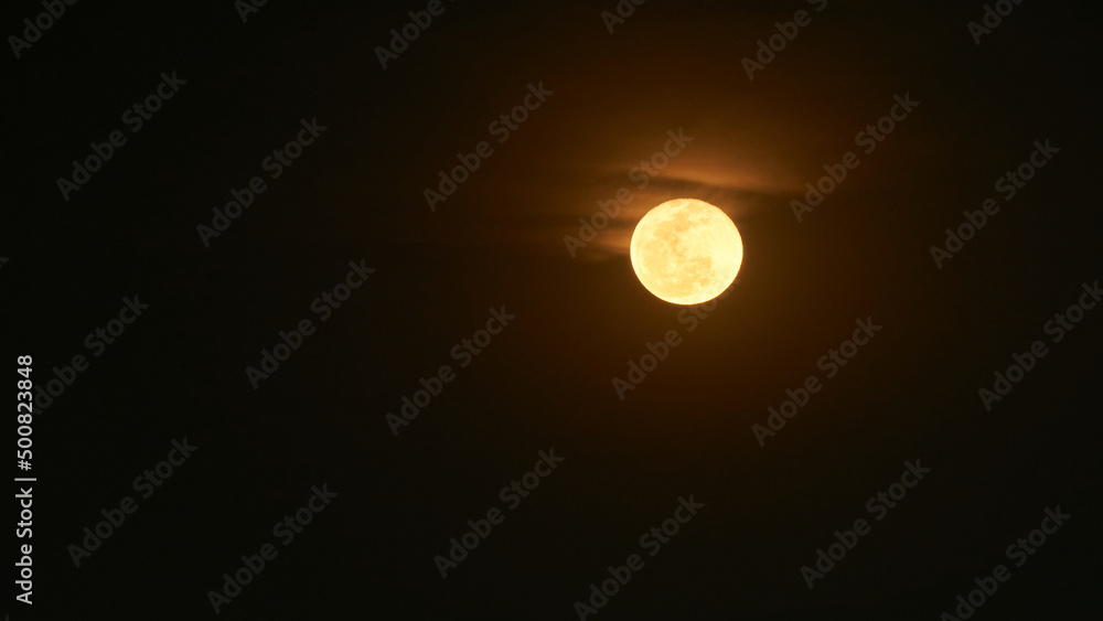 Canvas Prints view of the full moon with few clouds