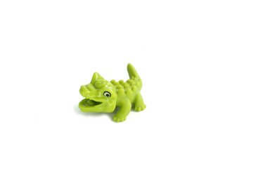 alligator, green crocodile toy made from rubber isolated on white background
