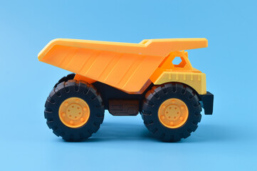 Toy loader truck isolated on a blue background