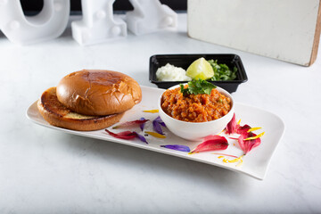 A view of a plate of pav bhaji.