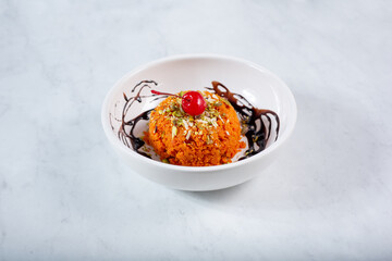 A view of a bowl of carrot pudding.