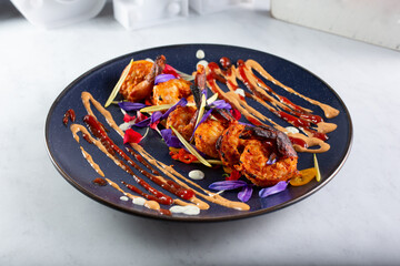 A view of a plate of tandoori shrimp.